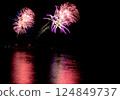 A series of colorful fireworks bursting into the midnight sky 124849737