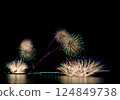 A series of colorful fireworks bursting into the midnight sky 124849738