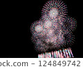 A series of colorful fireworks bursting into the midnight sky 124849742
