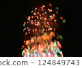 A series of colorful fireworks bursting into the midnight sky 124849743