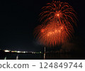 A series of colorful fireworks bursting into the midnight sky 124849744
