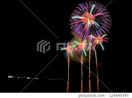 A series of colorful fireworks bursting into the midnight sky 124849745