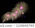 A series of colorful fireworks bursting into the midnight sky 124849749