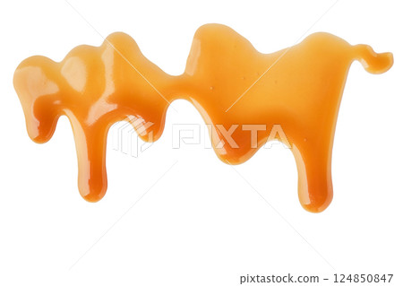 Dripping Melted caramel sauce drops on white background Dripping Melted caramel sauce drops on white background 124850847