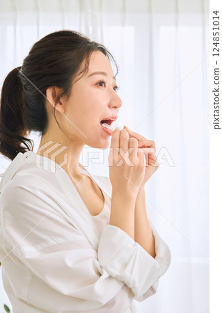 A woman wearing a mouthpiece A woman wearing a mouthpiece 124851014