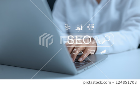 Businesswoman using a computer for analysis, SEO search engine optimization marketing Ranking traffic website internet business technology concept, Marketing planning, Data Search Technology. 124851708