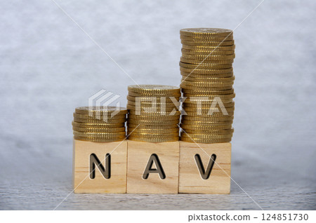 Net Asset Value text on wooden cubes with stacking golden coins. NAV and investment concept 124851730