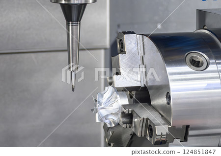 The 4-axis CNC milling machine cutting the turbocharger part with solid ball nose end mill tool. 124851847