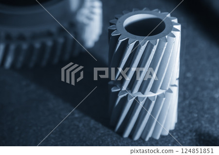 Close up scene small gear shape part from the metal 3D printing method in the light blue scene. 124851851