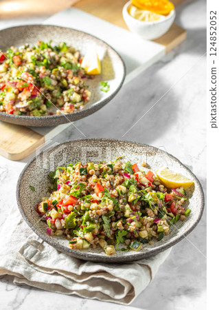 Buckwheat tabbouleh salad. Traditional middle eastern or arab dish. Levantine vegetarian salad. 124852052