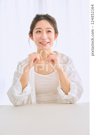 Female with mouthpiece correction 124852164