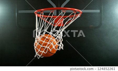Detail of basketball ball hitting the hoop, top view. Isolated on black background. Detail of basketball ball hitting the hoop, top view. Isolated on black background. 124852261