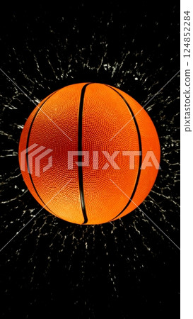 Detail of basketball ball with splashing water. Isolated on black background. Detail of basketball ball with splashing water. Isolated on black background. 124852284