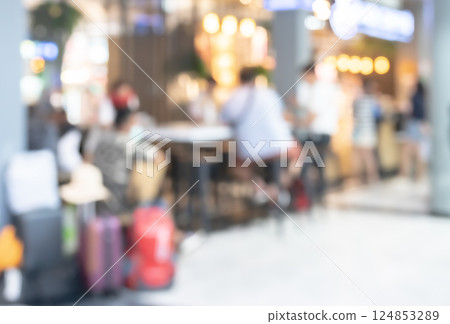 Blurry image of coffee shop or cafe restaurant with passengers in airport terminal for background Blurry image of coffee shop or cafe restaurant with passengers in airport terminal for background 124853289