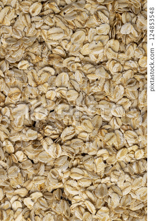 dry oat flakes from oatmeal , large amount of oat flakes for quick cooking of porridge in boiled hot water dry oat flakes from oatmeal , large amount of oat flakes for quick cooking of porridge in boiled hot water 124853548