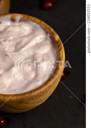 a fermented milk product made from milk with the addition of red sweet and sour currants and currant flavor 124853553