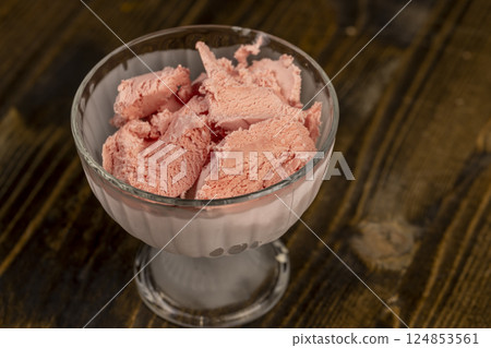 cold ice cream with berry flavor and smell, natural ice cream with added strawberry flavor 124853561