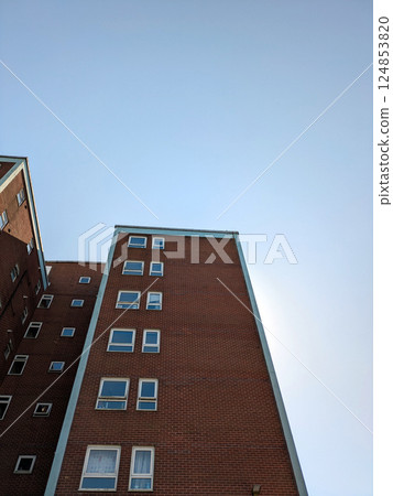 Top Floors of a Highrise Council Block of Flats Apartments with Blue Sky Top Floors of a Highrise Council Block of Flats Apartments with Blue Sky 124853820