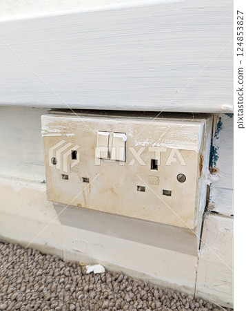 An old household plug socket that could be dangerous and need replacing DIY renovation An old household plug socket that could be dangerous and need replacing DIY renovation 124853827