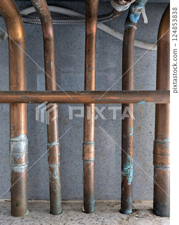 Old Copper Kitchen Bathroom Pipes in back condition house renovation DIY Project 124853838