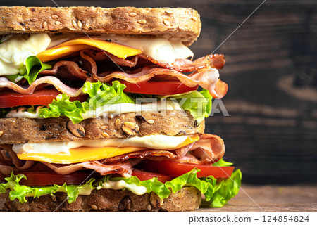 Double BLT sandwich with cheese close up Double BLT sandwich with cheese close up 124854824
