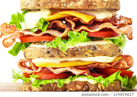 Double bacon, lettuce, tomato sandwich with cheese close up 124854827