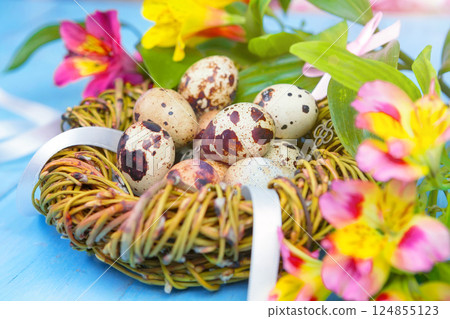 Happy Easter. Congratulatory easter background. Easter eggs and flowers. 124855123