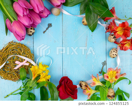 Pink tulips on wooden blue background. Conception holiday, March 8, Mother's Day. Flat lay and copy space Pink tulips on wooden blue background. Conception holiday, March 8, Mother's Day. Flat lay and copy space 124855125