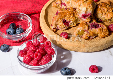 Pear and raspberry scones. Fresh pastries Pear and raspberry scones. Fresh pastries 124855151