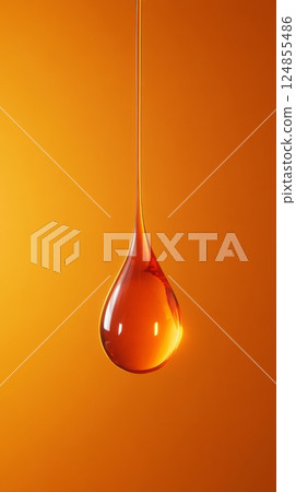 Single, elongated droplet hangs gracefully against a vivid orange background, capturing the essence of fluidity and elegance. The droplet's smooth surface reflects light beautifully Single, elongated droplet hangs gracefully against a vivid orange background, capturing the essence of fluidity and elegance. The droplet's smooth surface reflects light beautifully 124855486