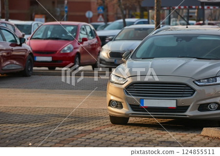 Many cars parking in a carpark parking lot 124855511