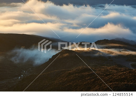 Volcanic mountain landscape, morning clouds twilight in Tongariro National Park Volcanic mountain landscape, morning clouds twilight in Tongariro National Park 124855514