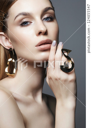 beautiful girl with Gold jewelry. Beauty Fashion Portrait beautiful girl with Gold jewelry. Beauty Fashion Portrait 124855547