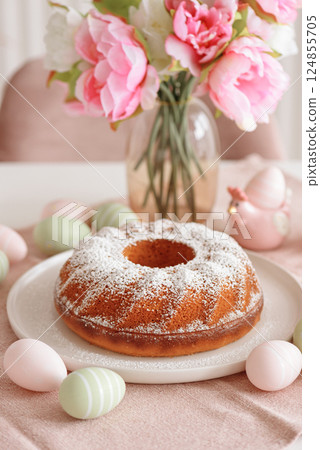 Traditional easter cakes with icing on white wooden table Traditional easter cakes with icing on white wooden table 124855705