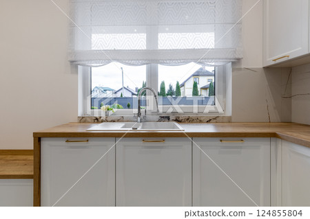 Modern Kitchen Sink with Window View Modern Kitchen Sink with Window View 124855804