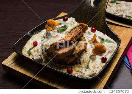 Draniki with chanterelle mushrooms, cream sauce Draniki with chanterelle mushrooms, cream sauce 124857673