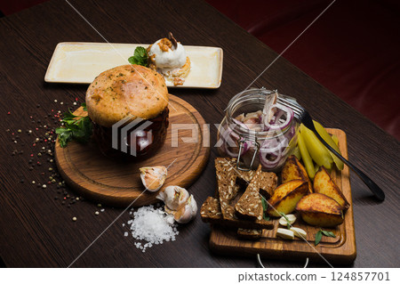 Set of Belarusian cuisine from a pot with herring Set of Belarusian cuisine from a pot with herring 124857701