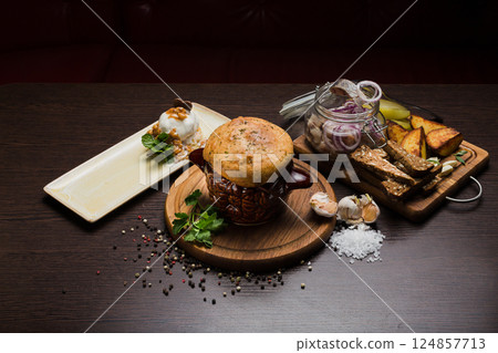Set of Belarusian cuisine from a pot with herring 124857713