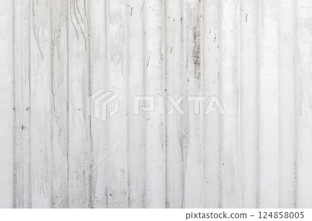 Close-up of a weathered, vertical, corrugated metal wall 124858005