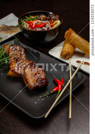 A set of Japanese dishes on the table 124858072