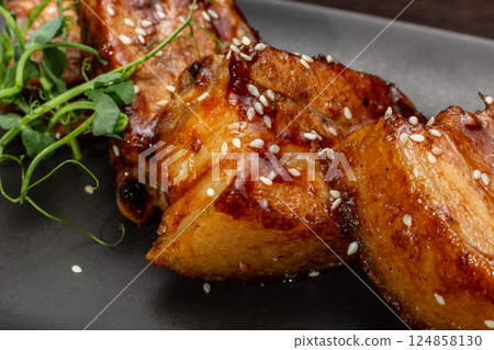 Stewed meat with sesame on a black plate, Japanese 124858130
