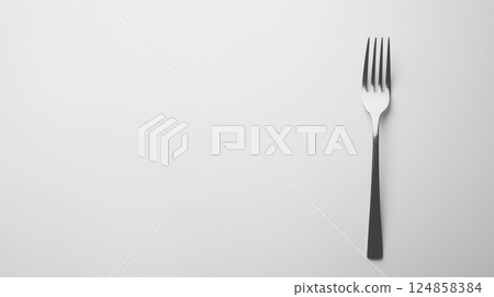 Elegant Fork on Simple Background for Culinary Uses Elegant Fork on Simple Background for Culinary Uses 124858384