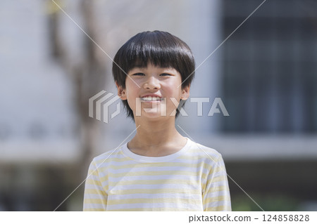 9 year old boy smiling at camera 124858828