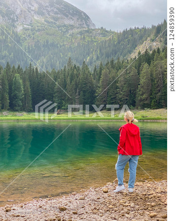 Woman in red windbreaker near the Black Lake in the Durmitor national park 124859390