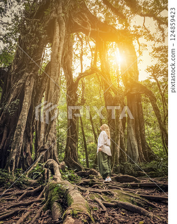 Woman near Giant Fig Tree in Bali Botanic Garden 124859423