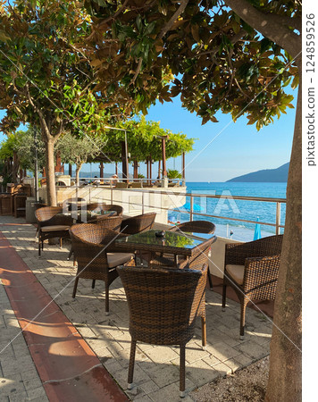 Empty restaurant tables on the embankment  resort town  Herceg Novi 124859526