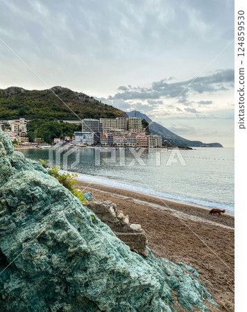 View from blue rock on empty beach in coastal town Rafailovici View from blue rock on empty beach in coastal town Rafailovici 124859530