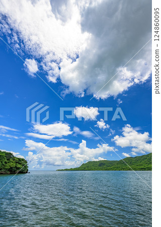 A view of Ishigaki Island's natural beauty with a striking contrast between the blue sky and clouds A view of Ishigaki Island's natural beauty with a striking contrast between the blue sky and clouds 124860095