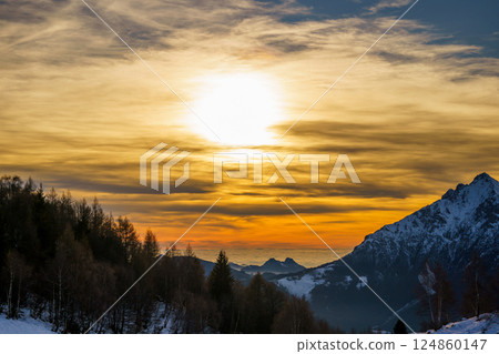 Bright Sun Over Snowy Mountain at Sunset, Piani di Bobbio, Italy 124860147