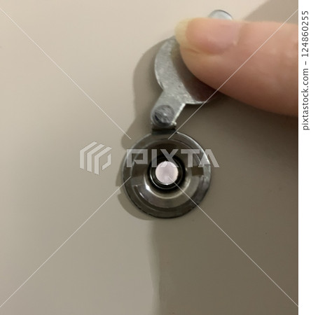 Look through the peephole in the door 124860255